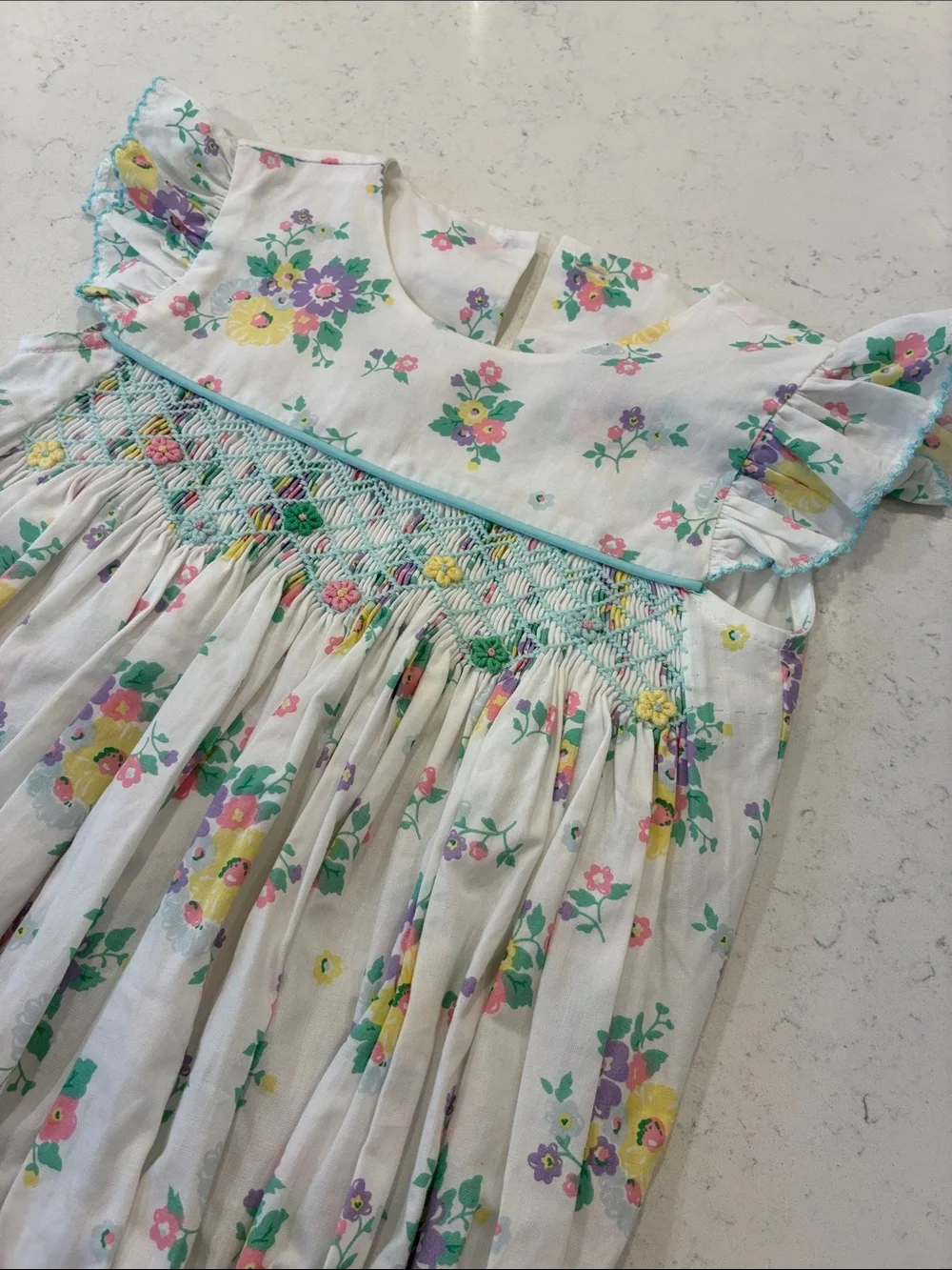 Floral Smocked Baby Romper - White with Yellow, Purple & Green Flowers